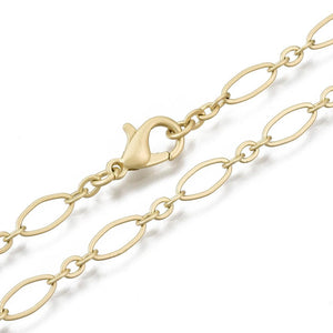 golden oval cable chain necklace with lobster claw clasp on white background. 