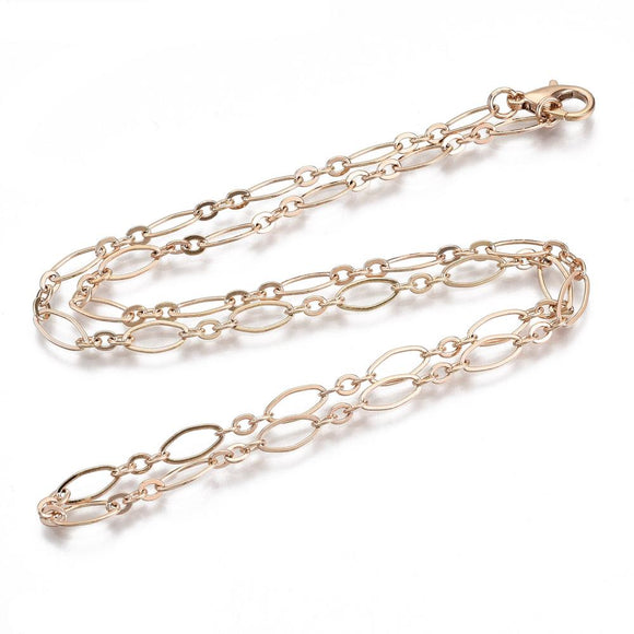 golden oval cable chain necklace with lobster claw clasp on white background. 