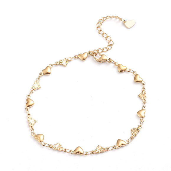 golden heart link bracelet with lobster claw clasp and extender chain with a heart charm on white background. 