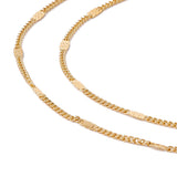 zoomed in sections of golden flat satellite curb chain on white background. 