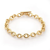 golden cable chain bracelet with a toggle clasp on a white background. 