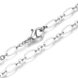 zoomed in sections of platinum color oval cable chain necklace with lobster claw clasp on white background. 