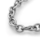 zoomed in section of stainless steel cable chain bracelet on a white background. 