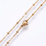 zoomed in sections of golden satellite cable chain necklace with lobster claw clasp on white background. 