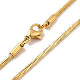 zoomed in sections of golden square snake chain necklace with lobster claw clasp on white background. 