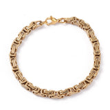 golden Byzantine chain bracelet with lobster claw clasp on white background. 