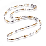 two-tone alternating golden and stainless steel horse eye link necklace with lobster claw clasp on white background. 