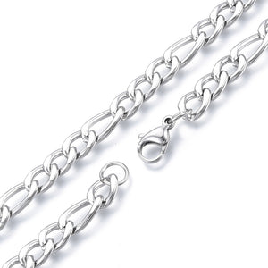 heavy golden Figaro chain necklace with lobster claw clasp on white background.